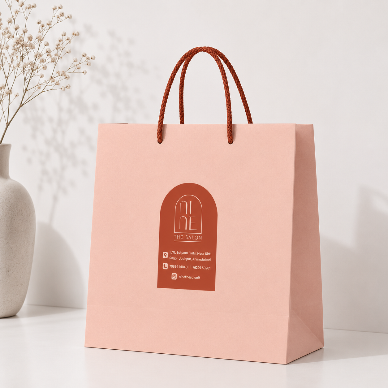 Nine The Salon blush carry bag with terracotta arch logo